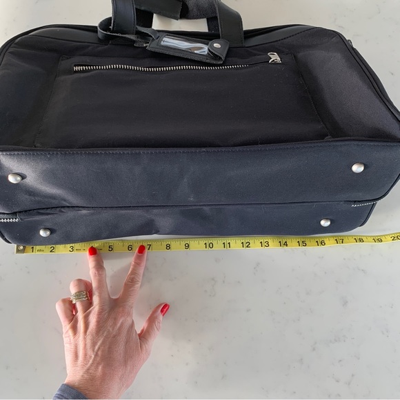 Black Travel Bag with Structured Design and Metal Feet - Picture 16 of 16